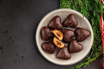 Gingerbread chocolate heart shaped honey cakes Christmas sweet dessert new year natural product tasty snack fresh delicious gourmet food background on the table rustic top view copy space