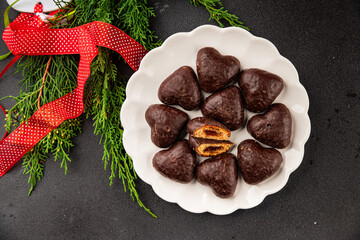 Gingerbread chocolate heart shaped honey cakes Christmas sweet dessert new year natural product tasty snack fresh delicious gourmet food background on the table rustic top view copy space
