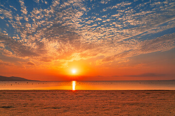 Fototapeta premium Spectacular sky at sunrise over Nartelle beach in Sainte Maxime