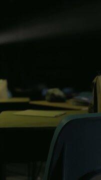 Desks and chairs are arranged in a darkened classroom, with a soft projection light illuminating the space. The atmosphere feels abandoned and quiet, evoking a sense of nostalgia.