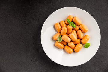 Sausage mini meat portion size fast food natural product tasty snack fresh delicious gourmet food background on table rustic top view copy space