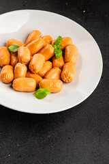 Sausage mini meat portion size fast food natural product tasty snack fresh delicious gourmet food background on table rustic top view copy space