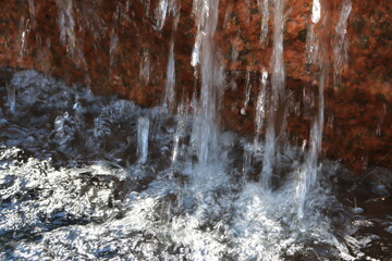 Granite Cascade: Water Dancing under Red Rock