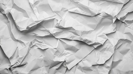Obraz premium This image features a close-up view of crumpled white paper, showcasing its intricate texture and folds, creating a dynamic visual effect.