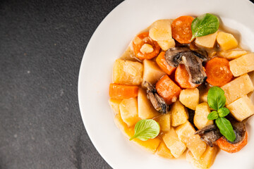 Potato stew mushrooms and vegetables natural tasty snack fresh delicious gourmet food background on the table rustic top view copy space keto and paleo diet vegerian and vegan food