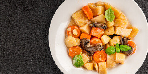 Potato stew mushrooms and vegetables natural tasty snack fresh delicious gourmet food background on the table rustic top view copy space keto and paleo diet vegerian and vegan food
