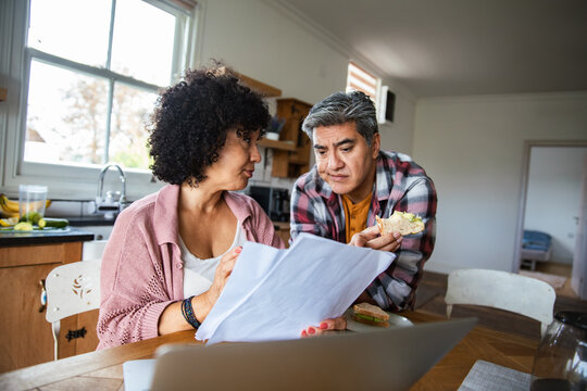 Mature couple going over bills and finances at home
