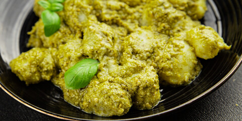 Gnocchi pesto sauce green tasty snack fresh gourmet food background on the table rustic top view copy space vegerian and vegan food