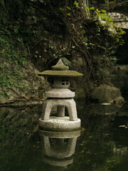 Chinese stone lantern in water © 语 吴