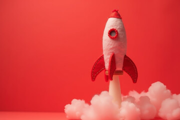 Rocket takes off - space ship with white clouds on red background. Hand made felt toys with copy space banner. AI