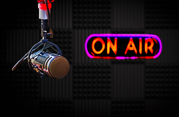 Microphone in radio studio and on air sign
