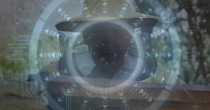 Beekeeper holding honeycomb frame while tech grid, reticle scanning cells for hive health