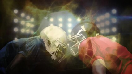 Floodlights intensifying driving energy around football players leaning heightening anticipation - Powered by Adobe