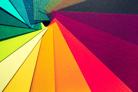 Color palette guide. Colored textured paper samples swatch catalog. Bright and juicy rainbow colors. Beautiful abstract background. Back to school. Office accessories.