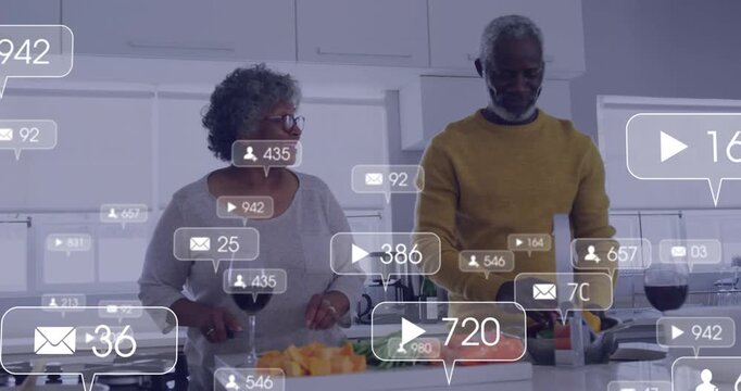 Play icon floating above cook and partner chopping produce on island, generating engagement icons