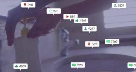 Woman's hand pressing soap dispenser pump and generating animated social media metrics around sink - Powered by Adobe
