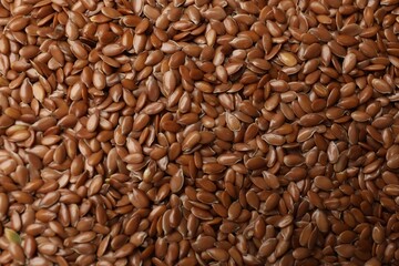 Many flax seeds as background, closeup view