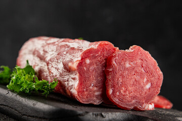 Dry sausage slice pork less fat jamon cured meat natural product tasty snack fresh delicious gourmet food background on the table rustic top view copy space