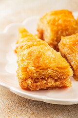Baklava with pistachios and almonds dessert oriental sweets natural product tasty snack fresh delicious gourmet food background on the table rustic top view copy space