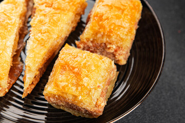 Baklava with pistachios and almonds dessert oriental sweets natural product tasty snack fresh delicious gourmet food background on the table rustic top view copy space