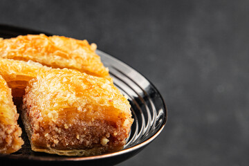 Baklava with pistachios and almonds dessert oriental sweets natural product tasty snack fresh delicious gourmet food background on the table rustic top view copy space