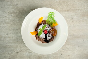 Gourmet Dessert, close up of a chocolate cake dessert with fruit
