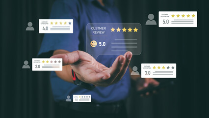 Businessman holding virtual customer review and rating system interface with five-star feedback....