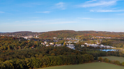 Naklejka premium Sauerland from above: View of the Oeseteiche and residential areas on a sunny autumn day in Menden Sauerland
