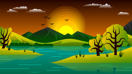 Beautiful summer natural sunset. The banks of a reservoir with grass and trees against the backdrop of hills, mountains, an evening sky with the setting sun, clouds, and flying birds.
