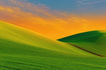 Obraz premium Rolling green hills under a vibrant, colorful sky at sunset