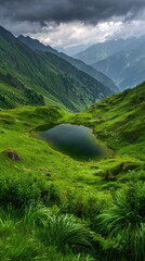 Lush mountain scene with a high-altitude lake reflecting the overcast sky