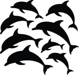 Silhouette of a pod of dolphins swimming in the ocean together