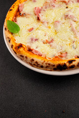 Pizza ham, cheese, tomato sauce fast food natural product tasty snack fresh delicious gourmet food background on the table rustic top view copy space