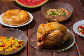Couscous with dried hands and turmeric, grilled whole chicken, flatbread,