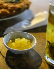 Description:
Warm traditional herbal ginger tea served in a glass mug on a wooden table. 