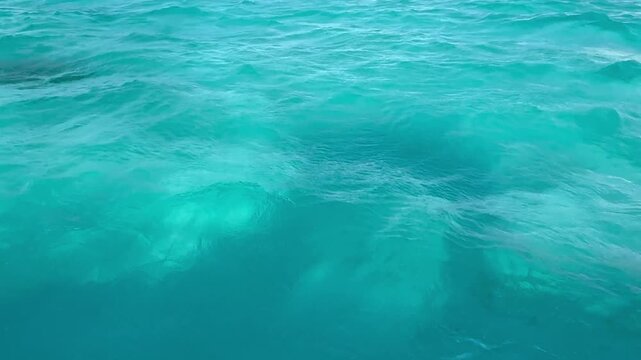 Beautiful turquoise-blue tropical water surrounding Christmas Island, also known as Kiritimati, in the remote Pacific island nation of Kiribati, showcasing the clear lagoon waters and pristine marine 