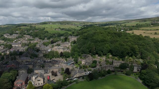 Aerial drone view of the town of Hebden Bridge in West yorkshire moving along the length of the town