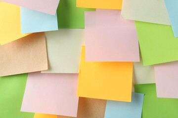 Many blank colorful sticky notes as background, top view