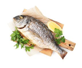 Tasty grilled fish with lemon and parsley isolated on white, top view