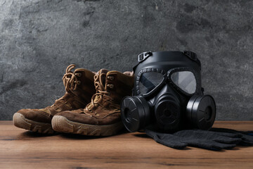Different safety equipment on wooden table. Space for text