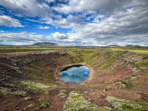 Drone Overview of Kerid Crater With Parking Lot and Tourists on Path