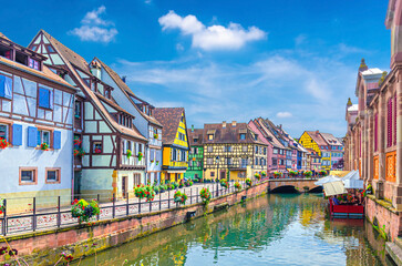 Little Venice la Petite Venise in old town Colmar city historic centre with old colorful houses medieval buildings on Quai de la Poissonnerie of river Lauch canal, Alsace Grand Est region, France