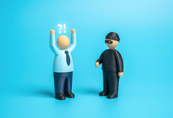 A thief robbed an office worker. A scammer defrauds a businessman. Extortion and blackmail in the corporate sphere. Risk management, cybersecurity, and business protection