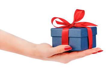 Female hand holding small blue gift box with red satin ribbon bow isolated elegant holiday concept...