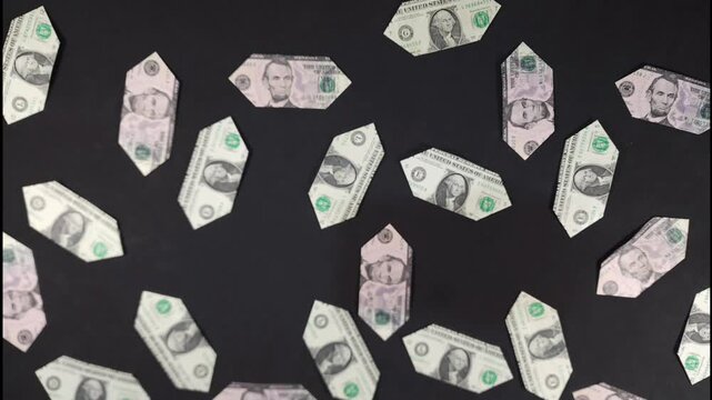 Stop motion, the number 2026 on US dollar bills unravels and separates