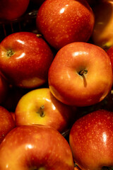 Red and green apples displayed at grocery market