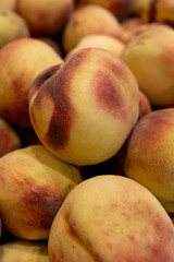 Fresh white peaches with red blush at grocery market