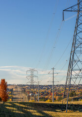 Colorado Living. Centennial, Colorado - Denver Metro Area Residential Autumn Panorama with high voltage poles and the view of the Front Range mountains in the distance