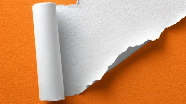 A curled white sheet reveals an orange textured surface, torn with a jagged edge