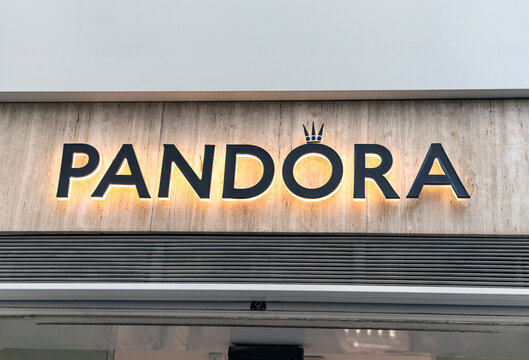 Seville, Spain; October 15, 2025: Pandora jewelry store backlit logo sign on storefront.